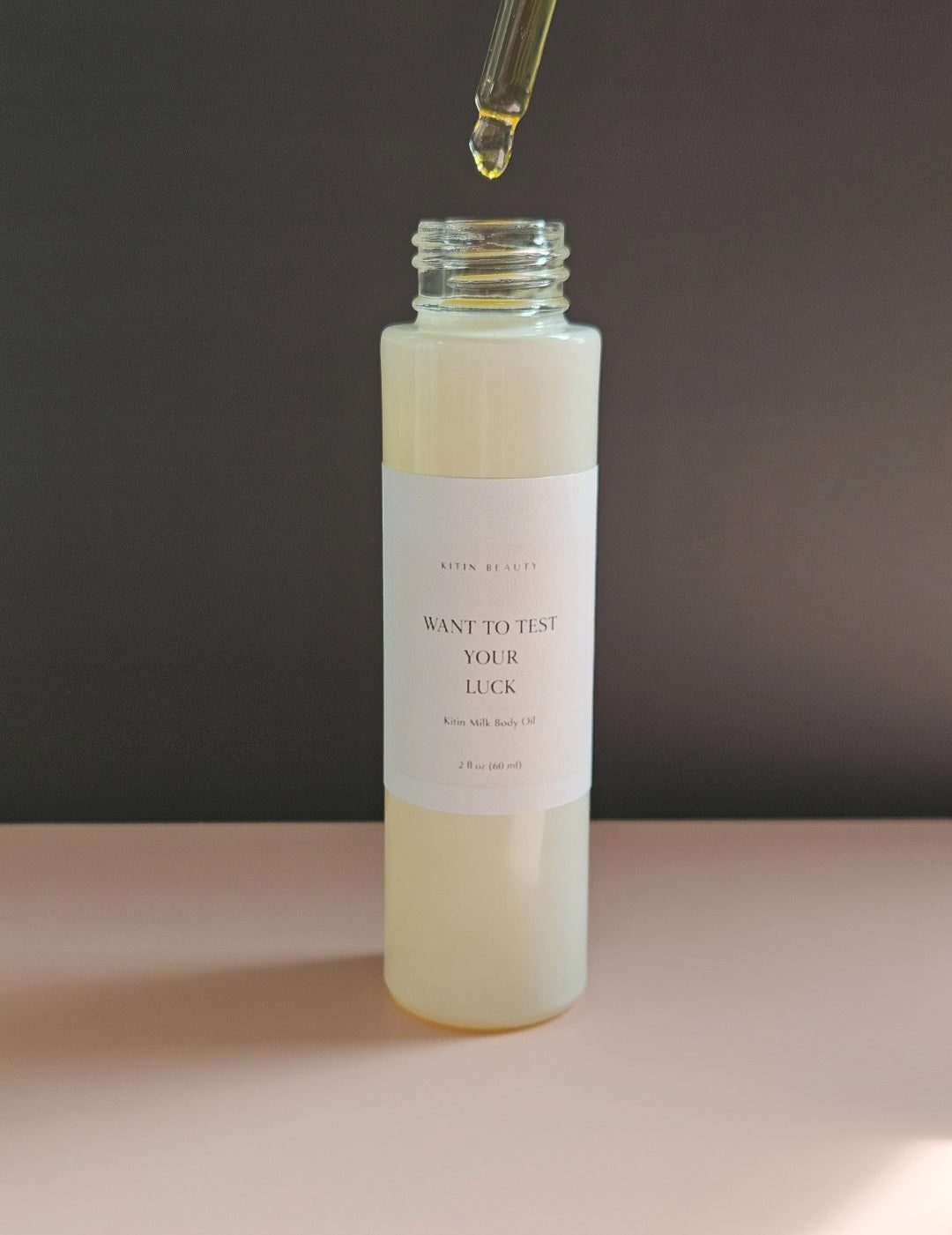 Kitin Milk Body Oil – Want to Test Your Luck | Smells Like: Juicy Pear Jasmine Orange Blossom, Coconut Caramel | Vibe: Playful Dangerous Hard to Forget
